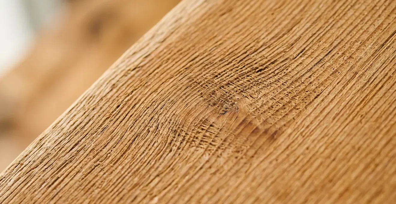 Close-up view of wooden musical instrument showing environmental stress effects