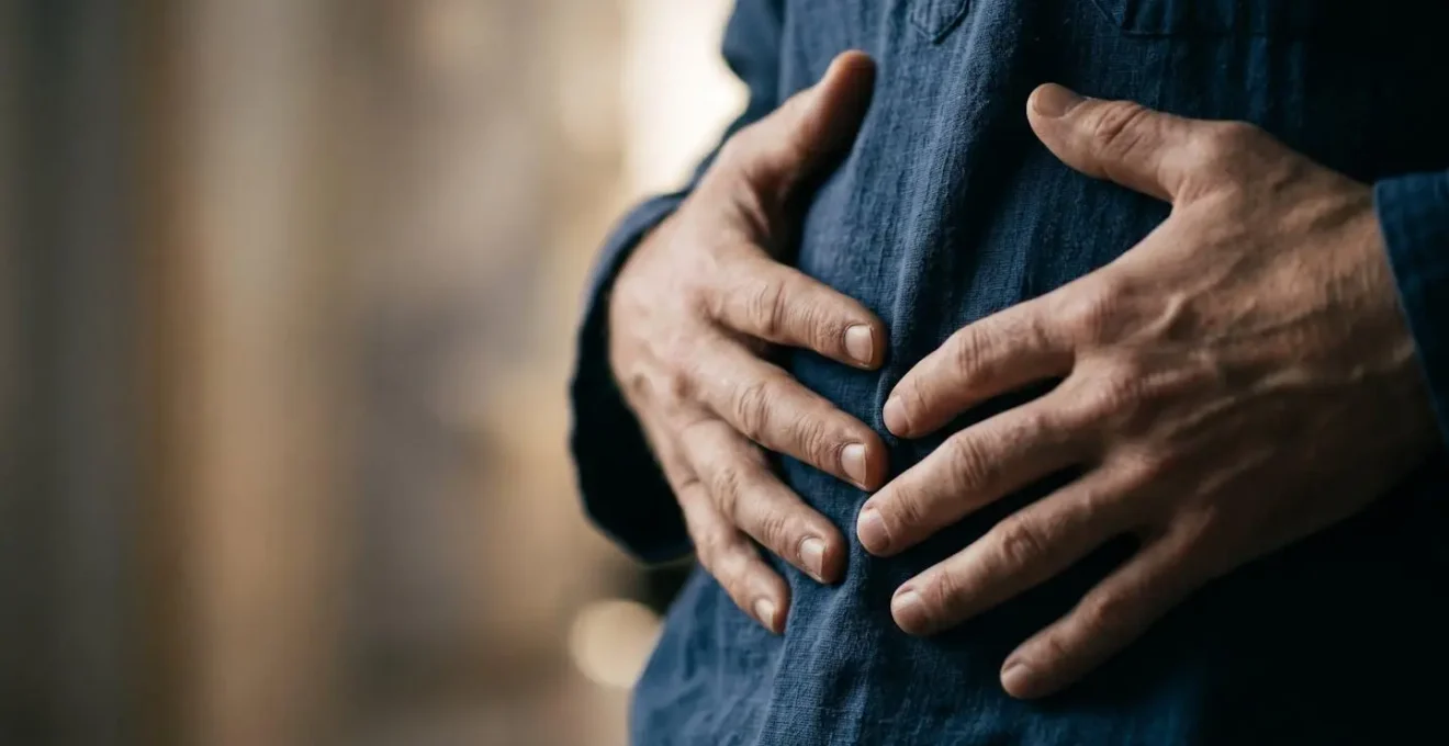 Extreme close-up of a performer's torso and hands in a moment of controlled breathing, captured with shallow depth of field