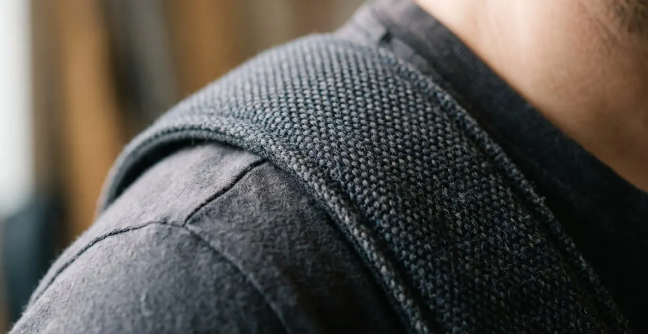 Close-up macro detail of wide guitar strap material showing texture and pressure distribution