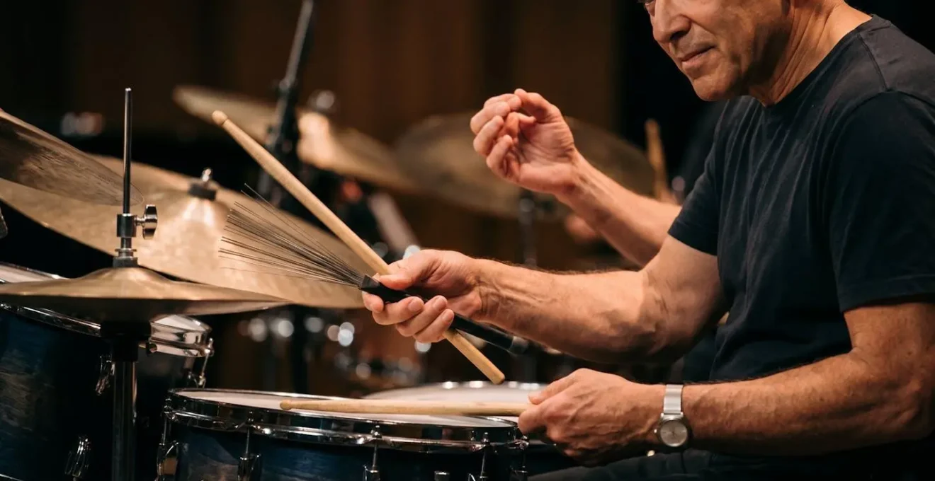 Jazz drummer using subtle body language to signal the end of a musical phrase during live performance