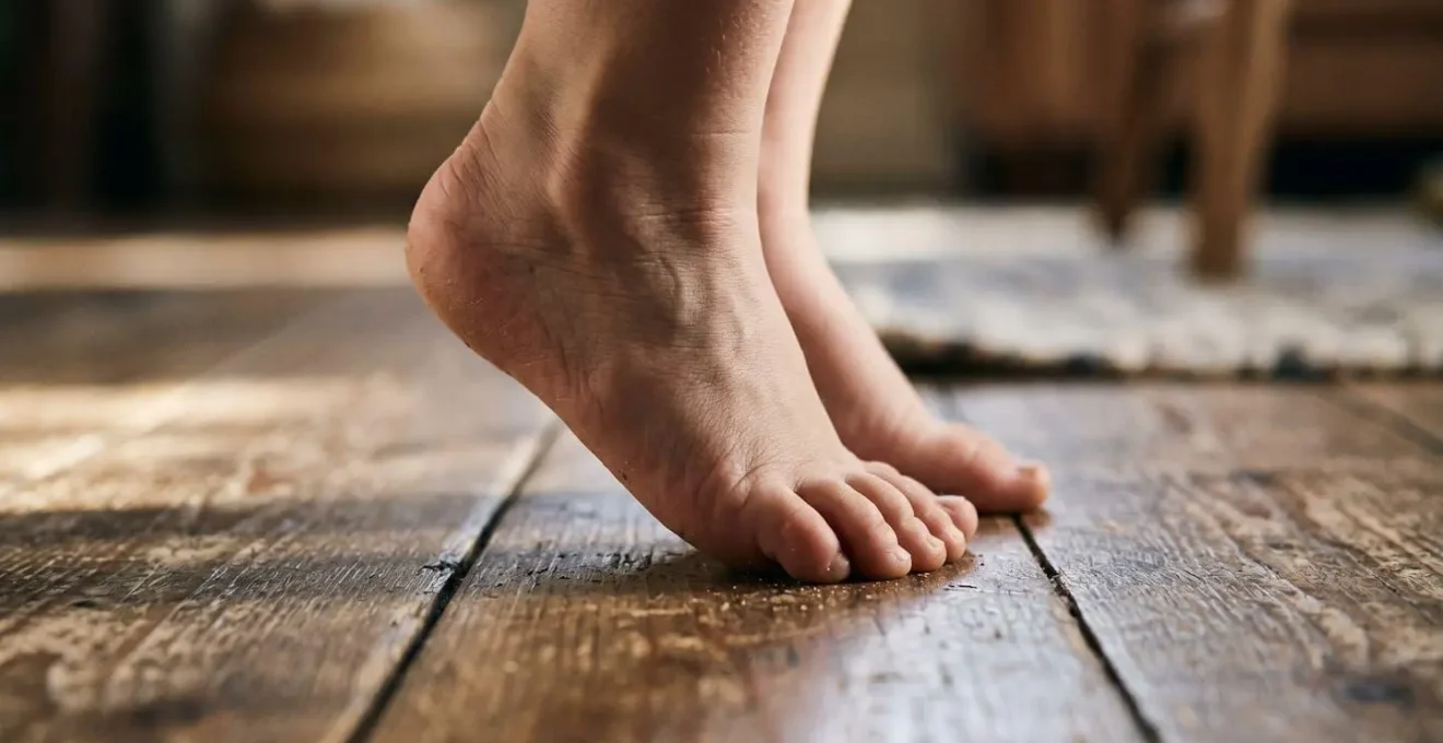 Close-up of child's feet mid-jump showing dynamic movement and balance development